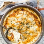 A baking dish full of Au Gratin potatoes.