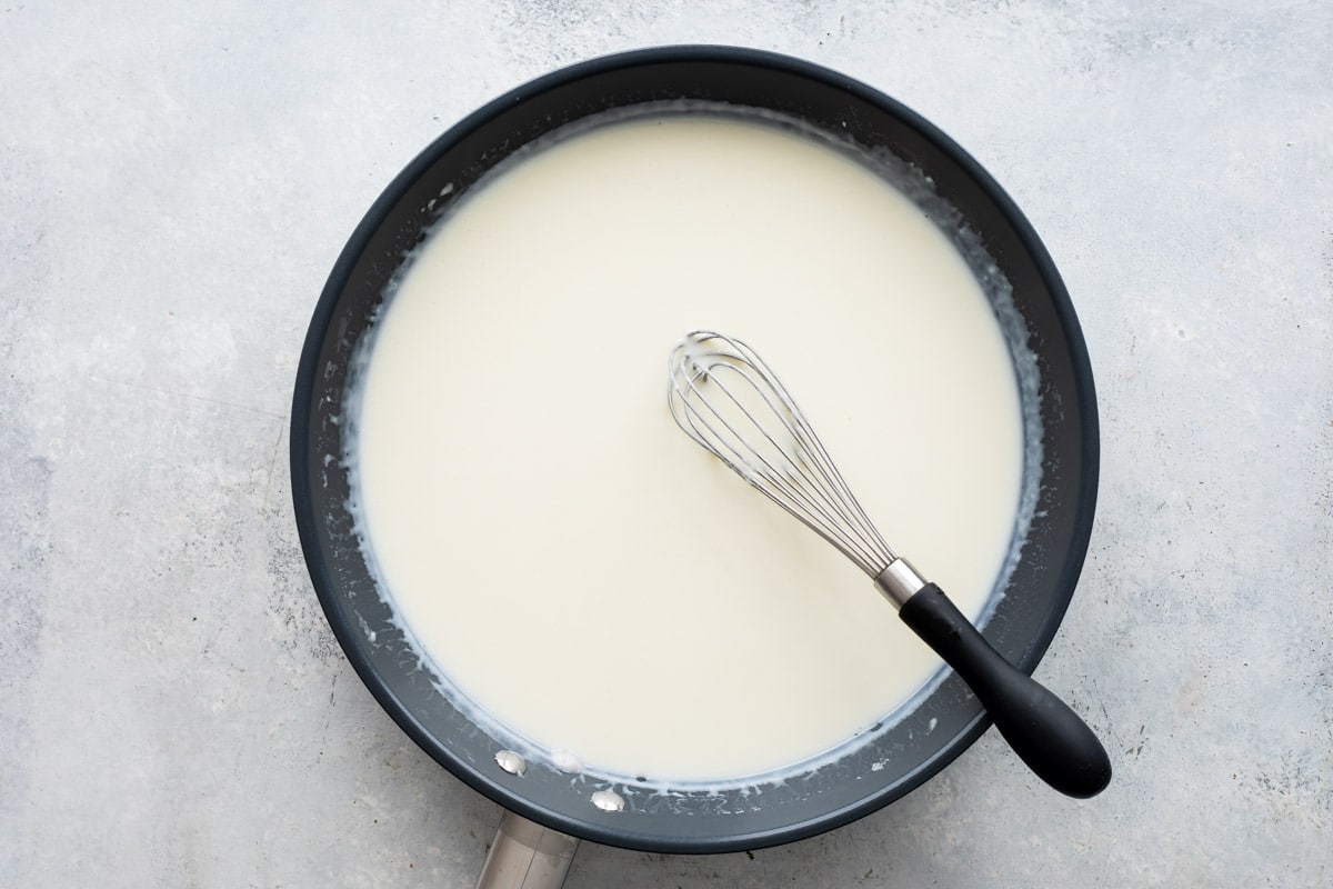 A skillet full of homemade cream sauce.