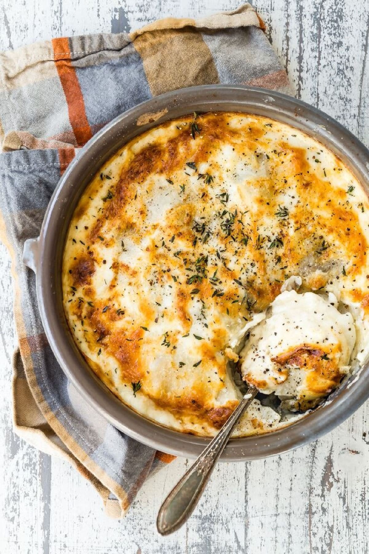 A baking dish full of Au Gratin potatoes.