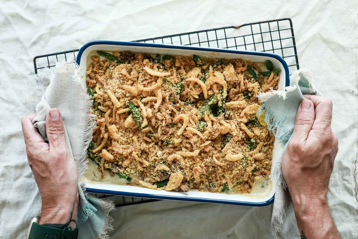 A casserole dish full of green bean casserole.