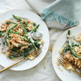 Two plates with green bean casserole.