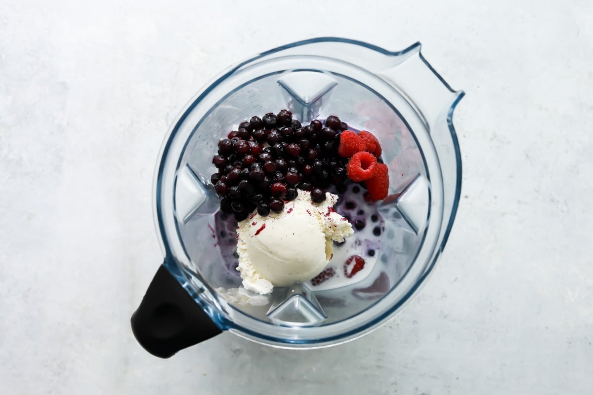 Ingredients for a grimace shake in a blender.