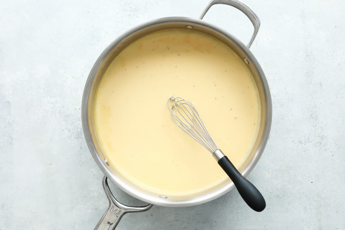 Homemade cheese sauce in a skillet.