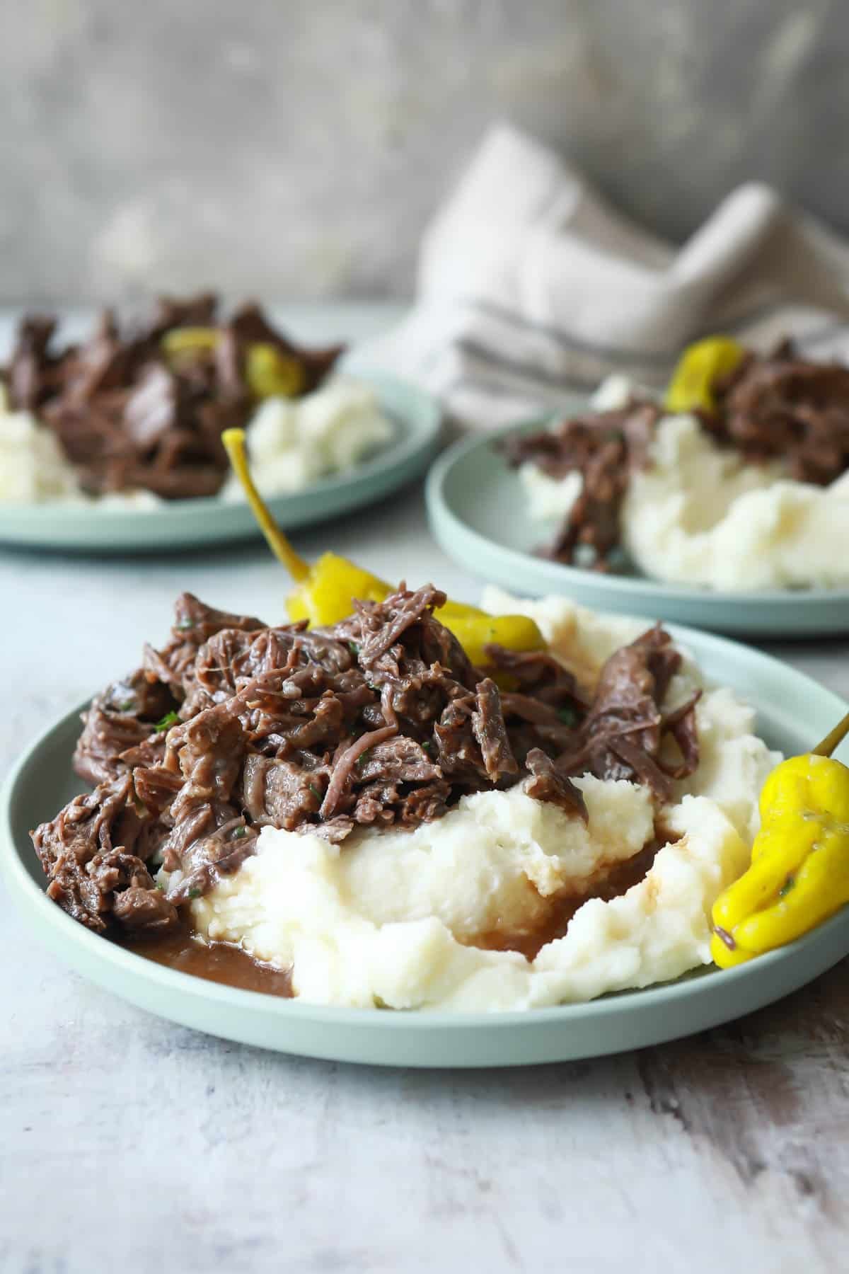 Mississippi pot roast over potatoes with gravy.