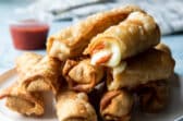 A plate of pizza sticks.