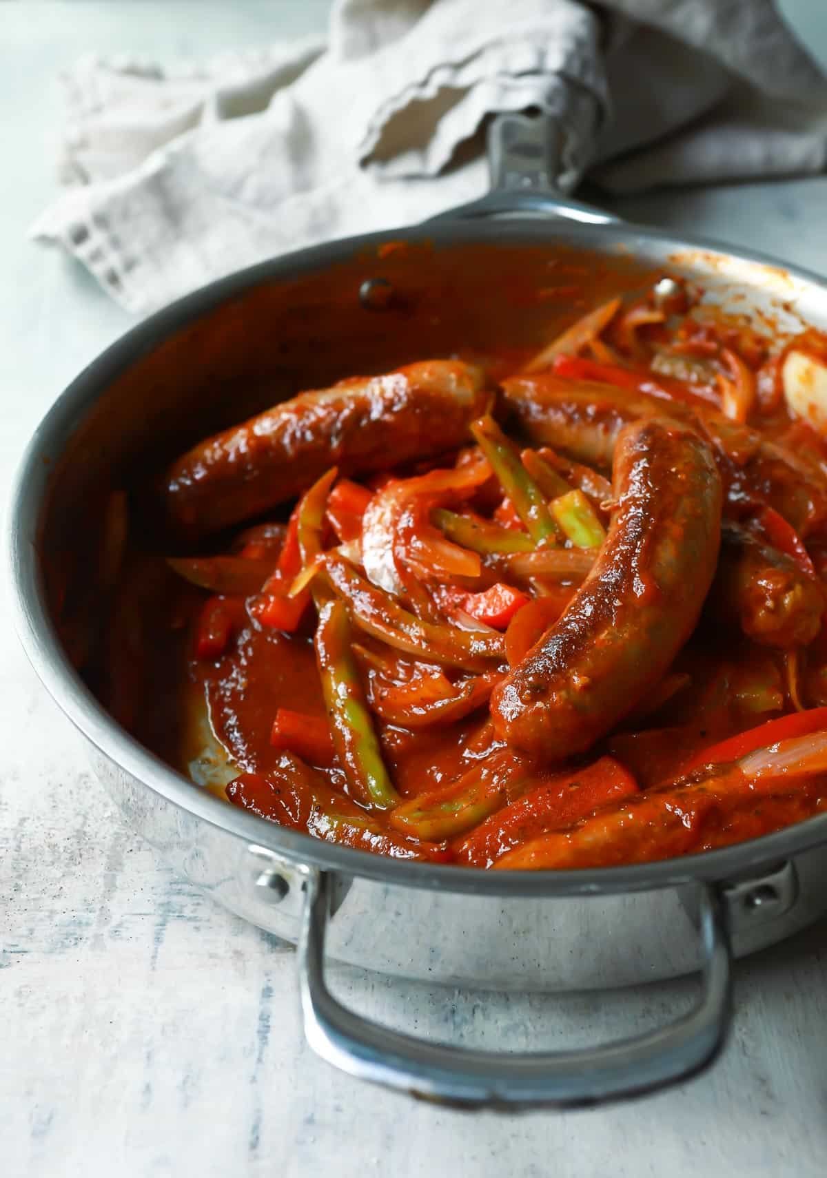 A skillet of sausage and peppers.