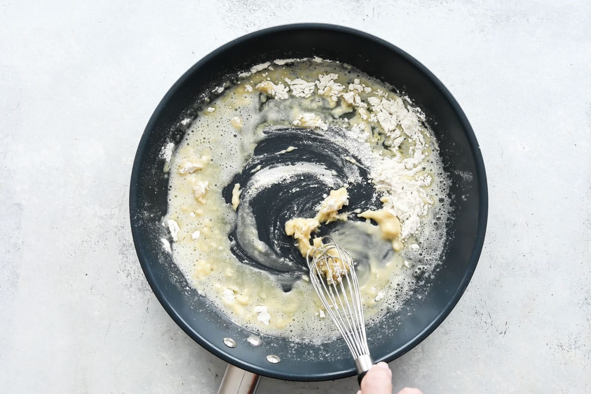 Cooking butter and flour together for a sauce.