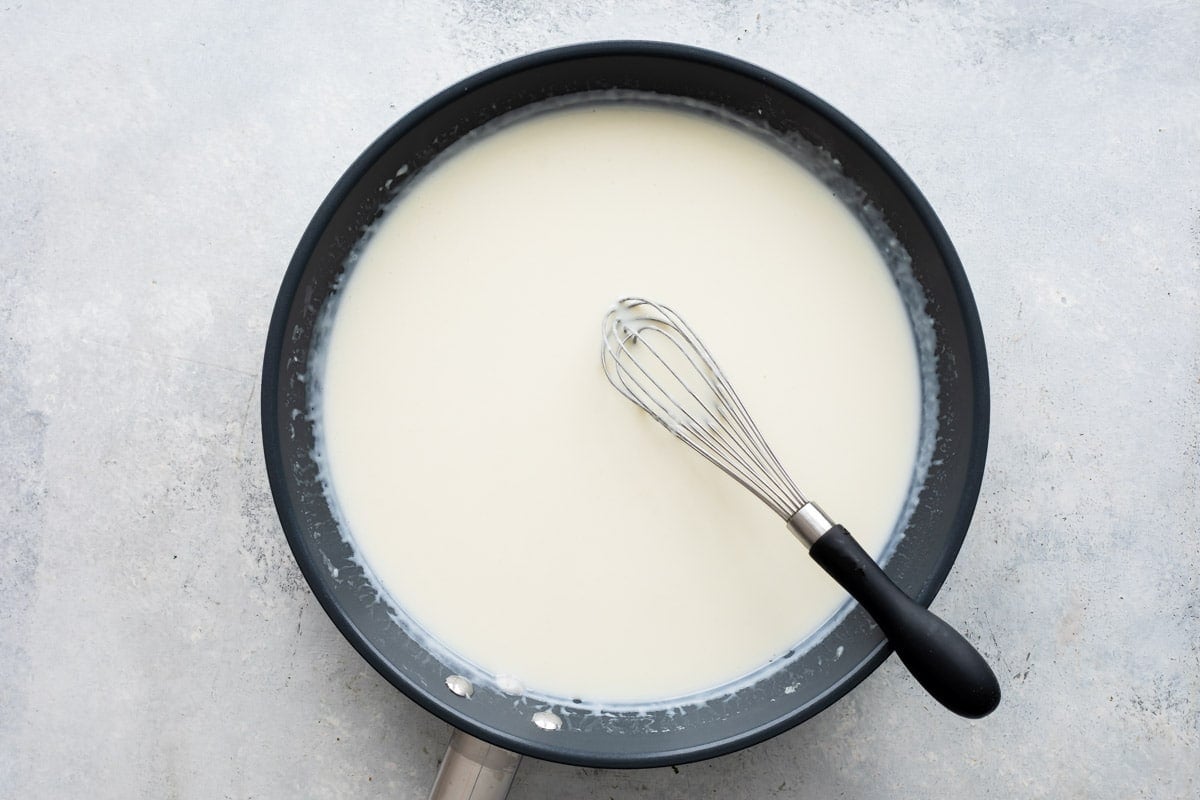 A skillet full of homemade cream sauce.