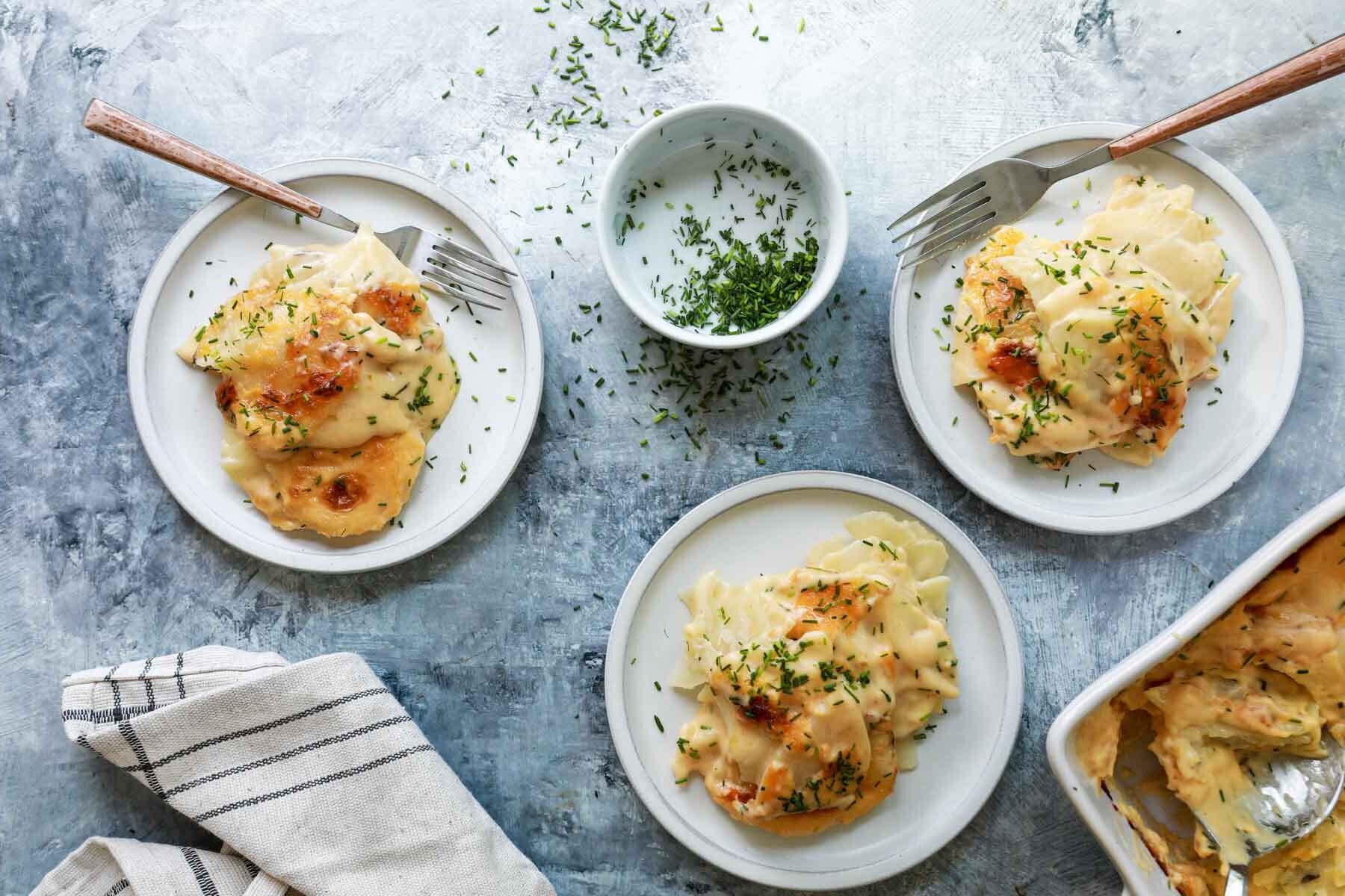 Plates of scalloped potatoes.
