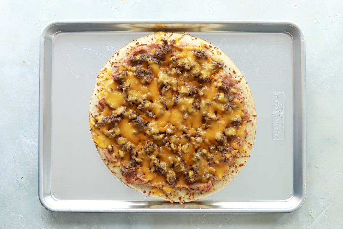 A taco pizza after being baked.