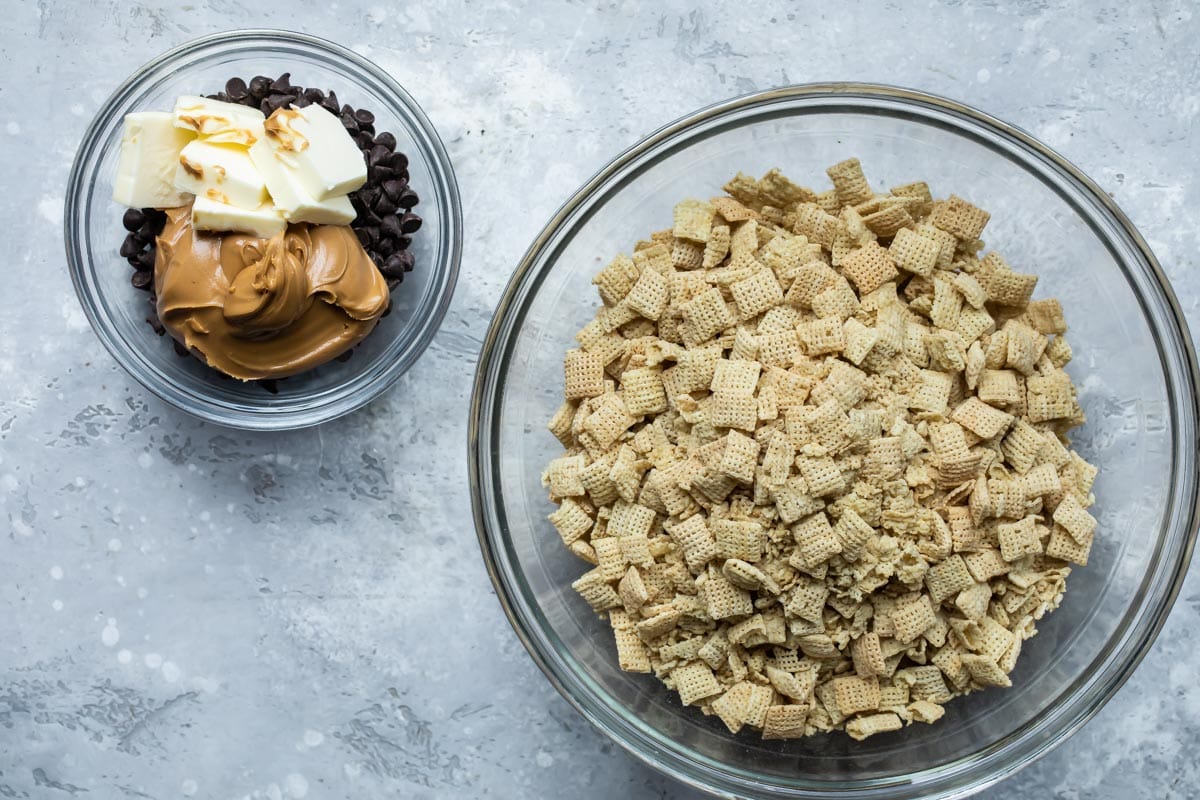Making puppy chow in a clear glass bowl.