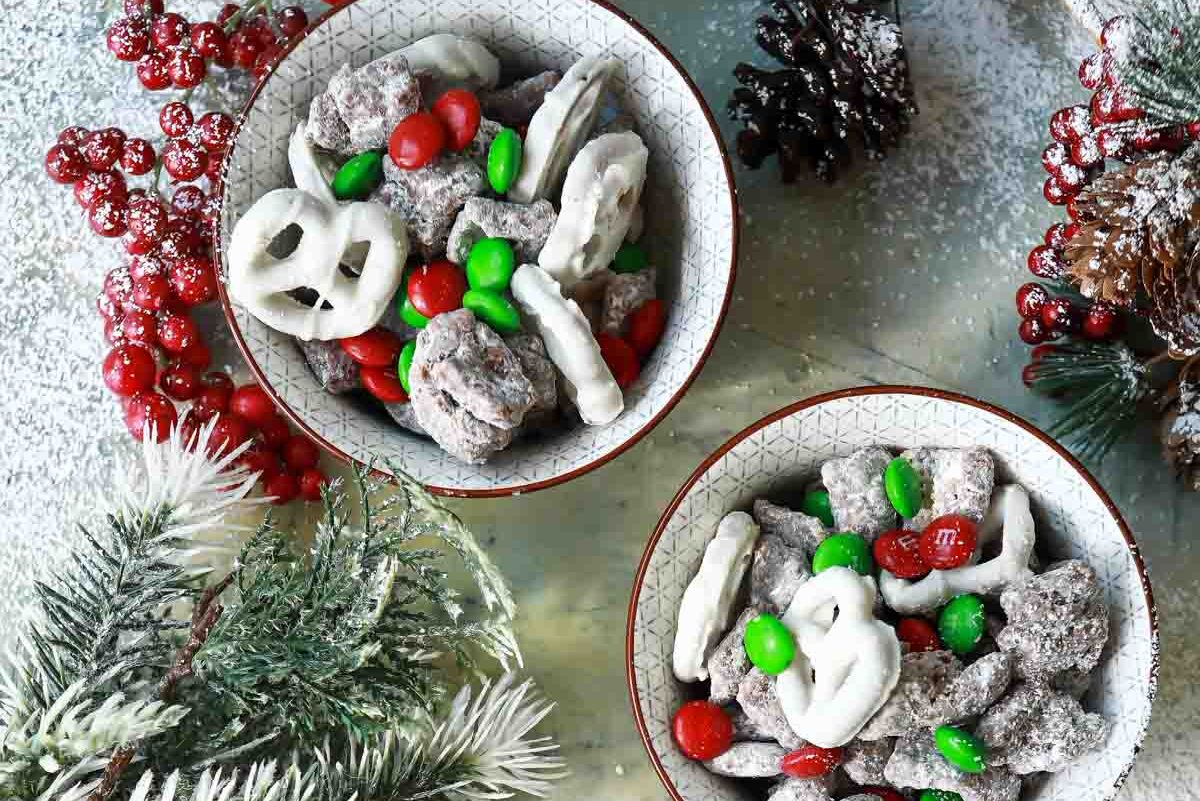 Christmas puppy chow in three cups.