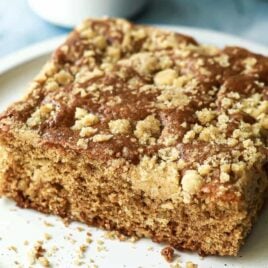 A piece of coffee cake on a small plate.