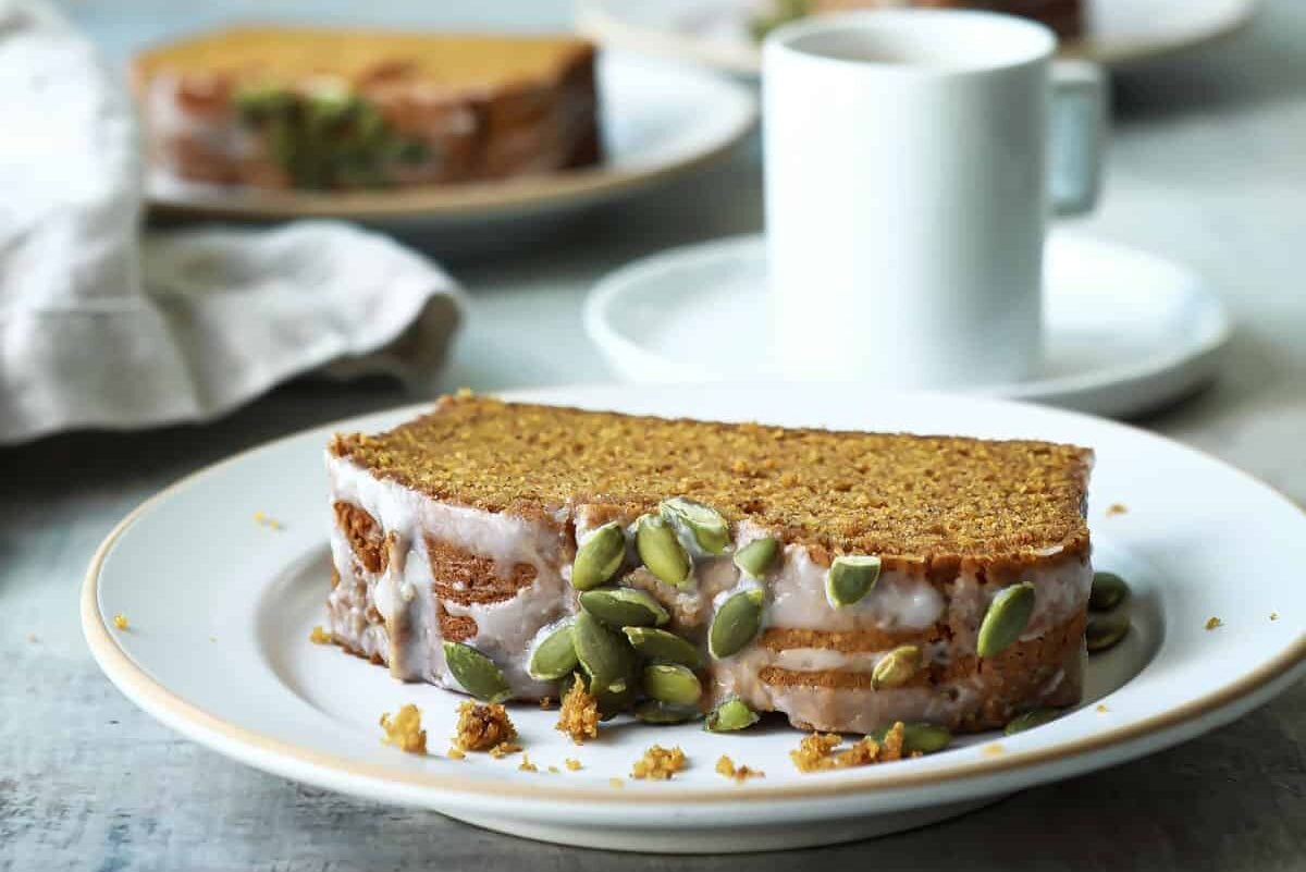 A slice of pumpkin bread on a plate.