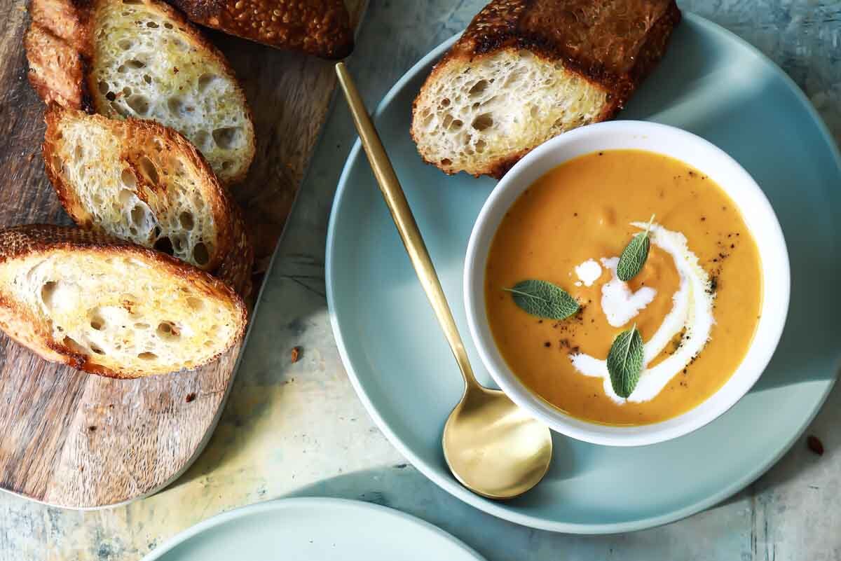 Two bowls of pumpkin soup.