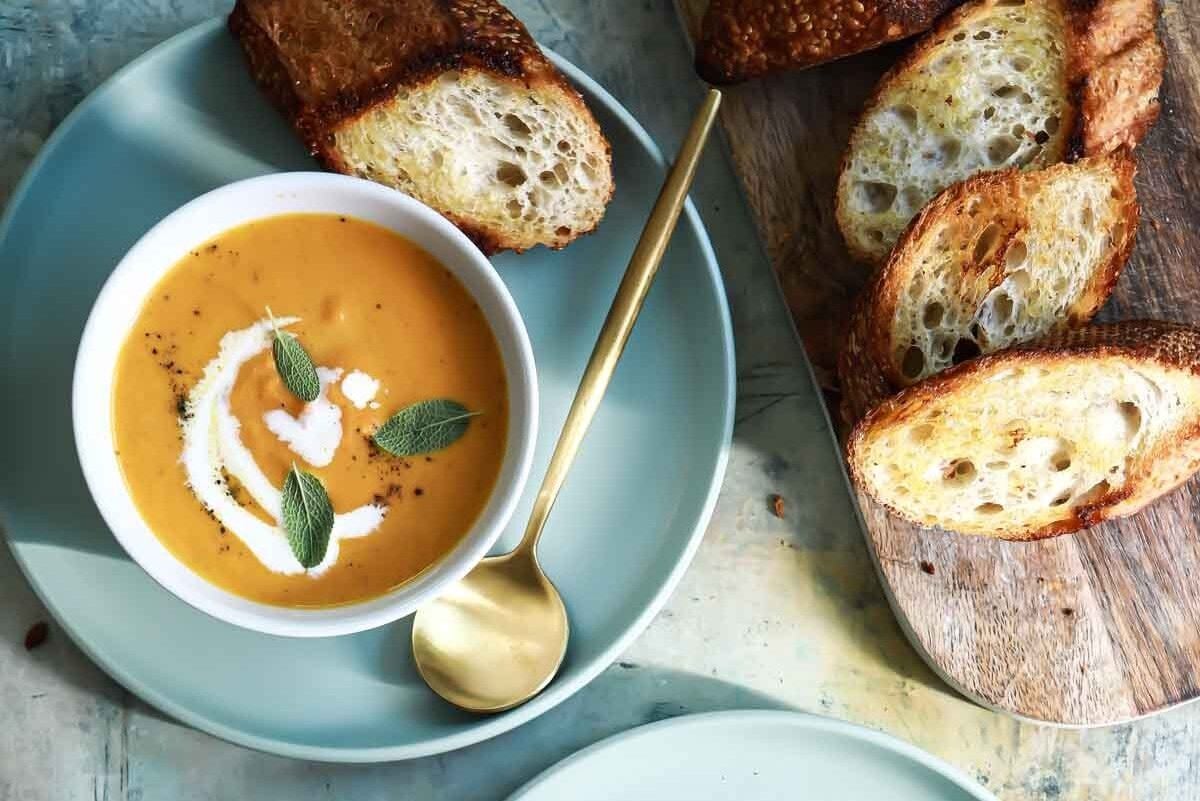 Two bowls of pumpkin soup.
