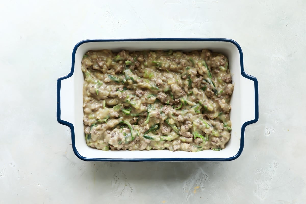 The filling for tater tot casserole in a pan.