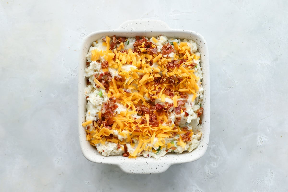 A baking dish of twice baked potatoes casserole.