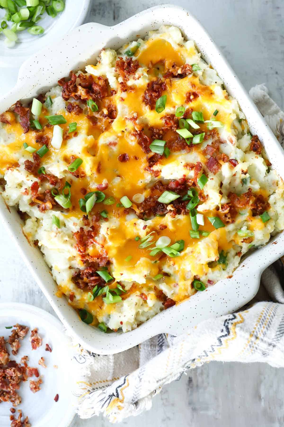 A baking dish of twice baked potatoes casserole.