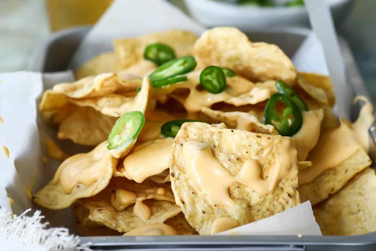 A pan of nachos and cheese.
