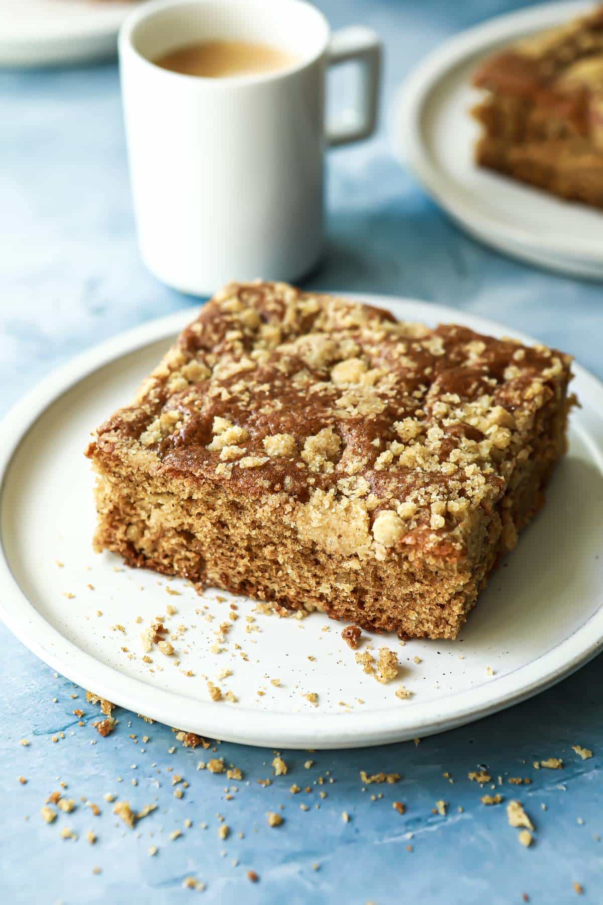 A piece of coffee cake on a small plate.