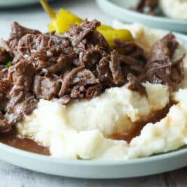 Mississippi pot roast over potatoes with gravy.
