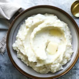 A bowl of sour cream mashed potatoes.