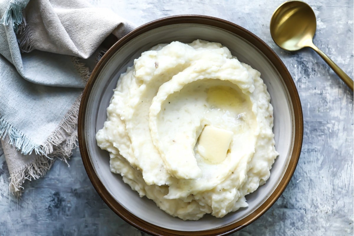A bowl of sour cream mashed potatoes.