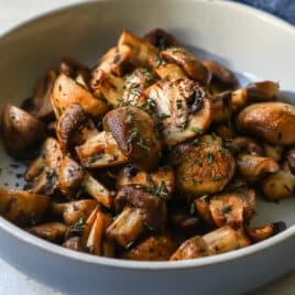 Air fryer mushrooms in a gray bowl.