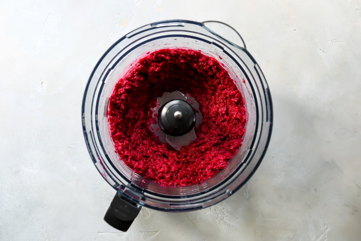 Beet hummus in a food processor.