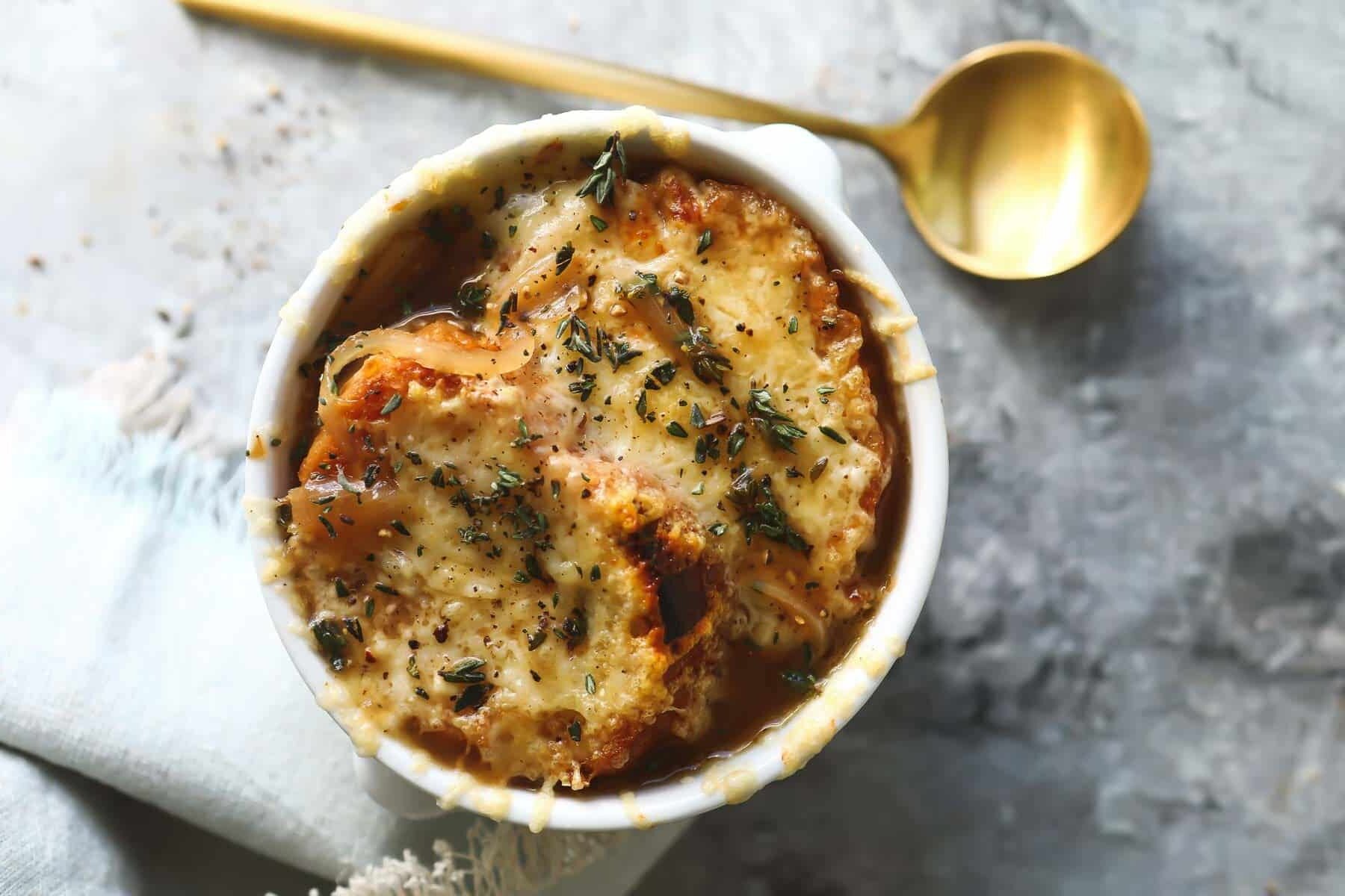 French onion soup in a white bowl.