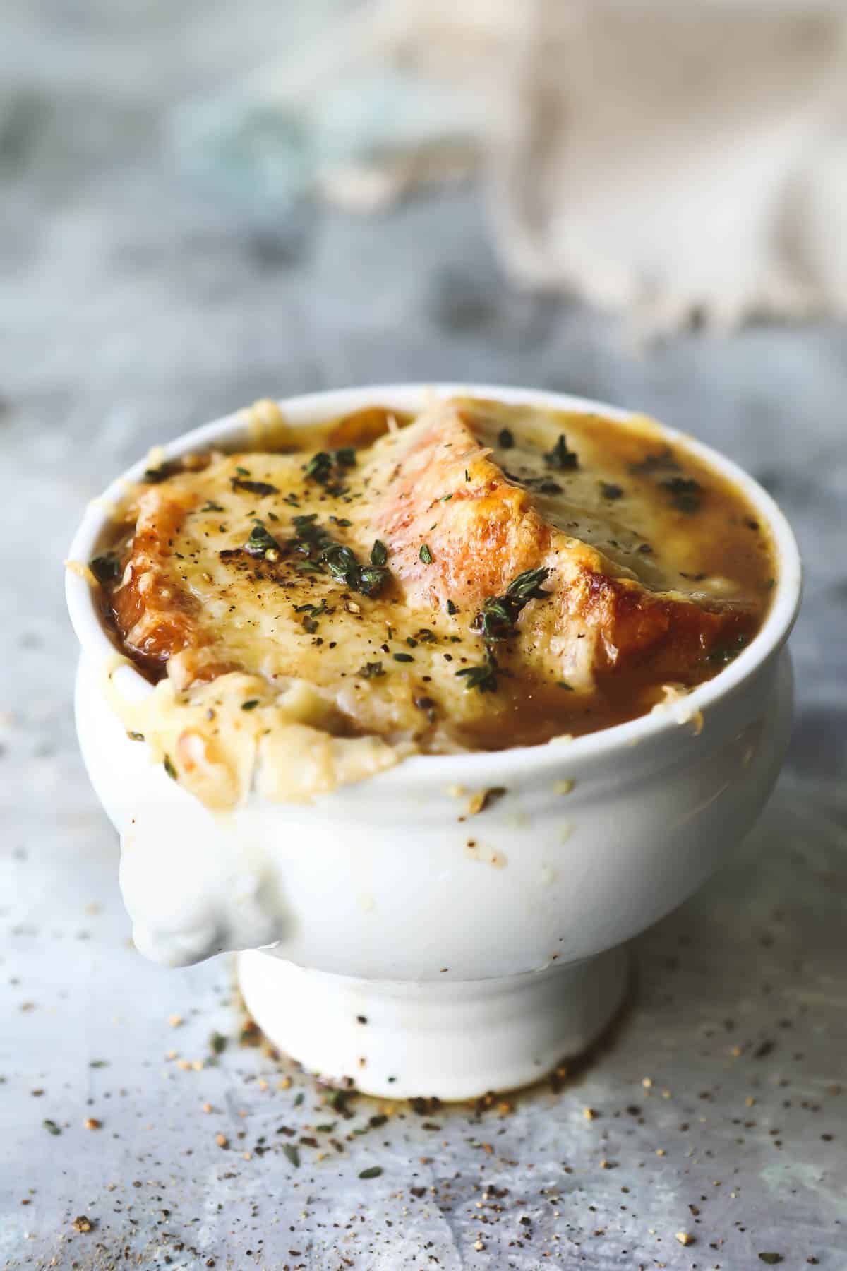 French onion soup in a white bowl.