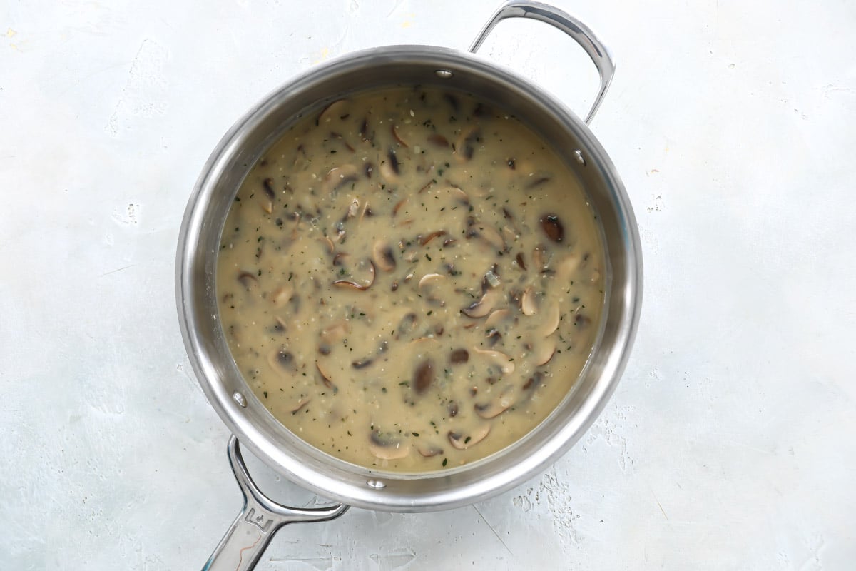 A silver skillet of mushroom gravy.