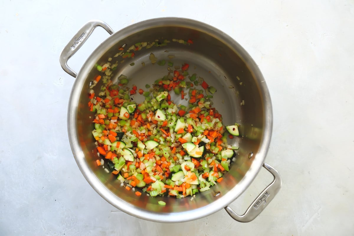 Vegetables for Olive Garden minestrone in a pot after being cooked in olive oil.