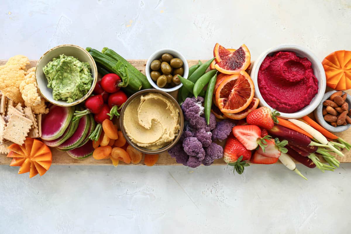A board filled with various foods for a vegan charcuterie board.