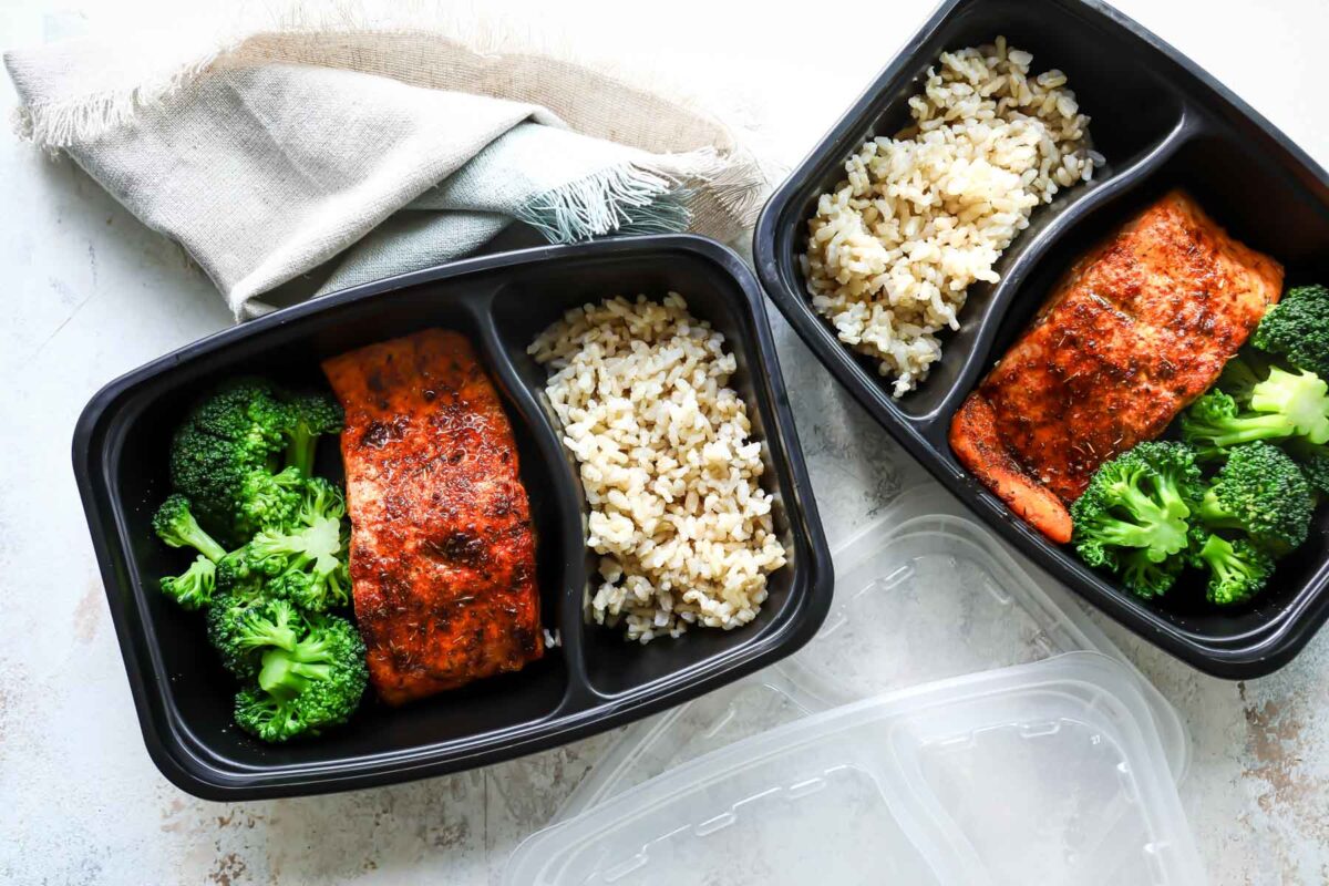 Two to go containers with air fryer salmon, broccoli and rice.