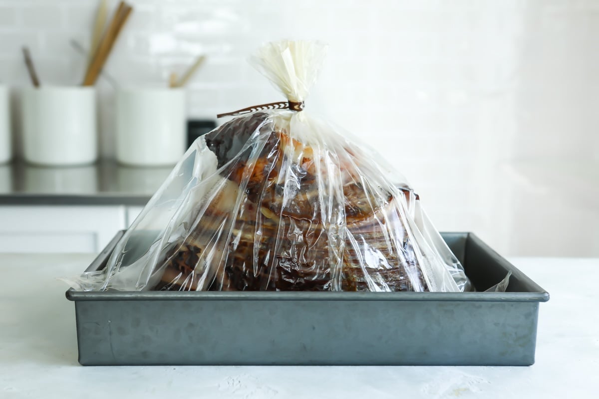 A sliced ham in a plastic oven bag.