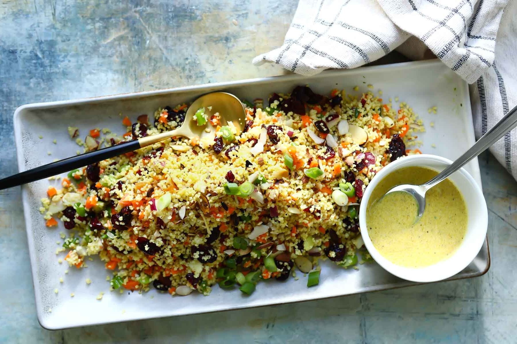 Couscous salad on a rectangular serving platter.