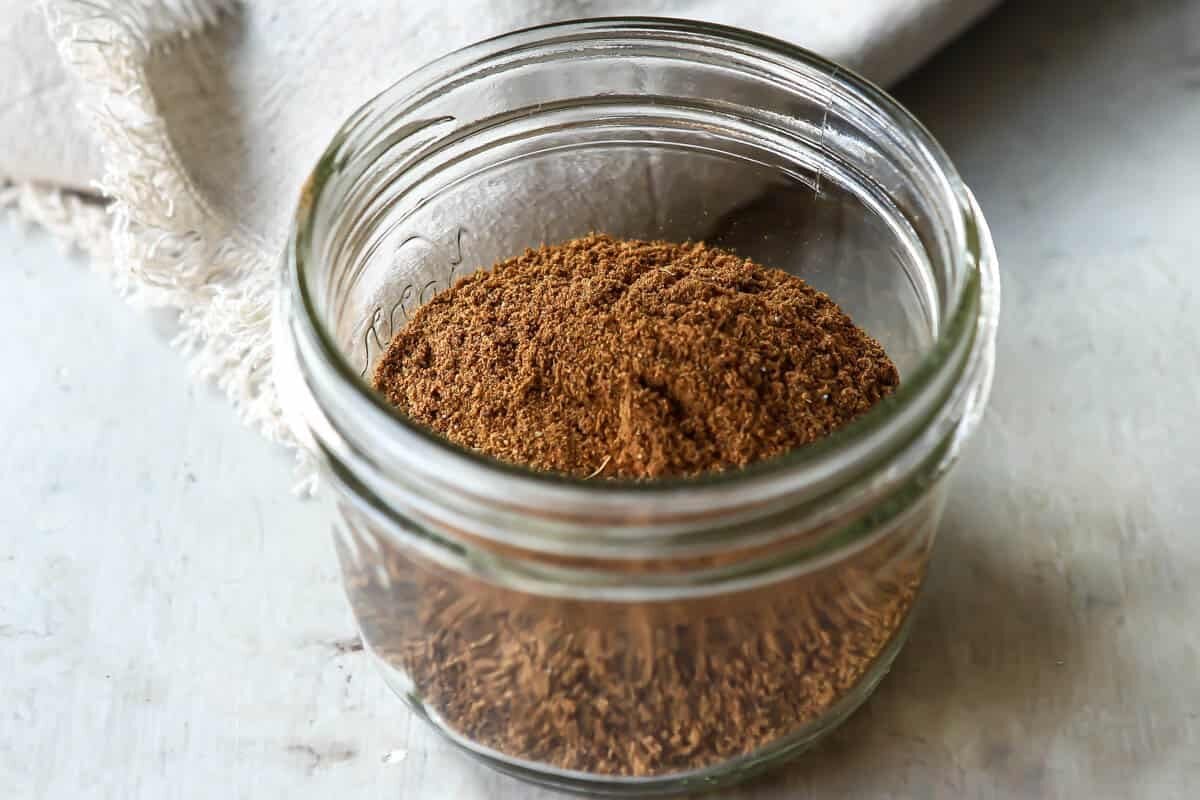 Garam Masala in a small glass jar.