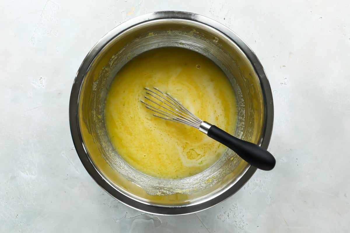 Whisking together ingredients for lime curd.