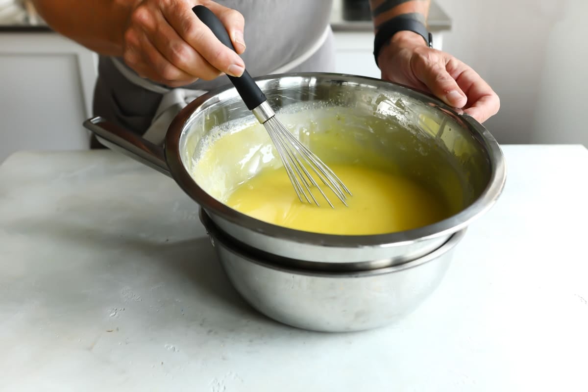 Cooking lime curd in a double-boiler.