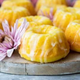 Mini lemon bundt cakes on a board.