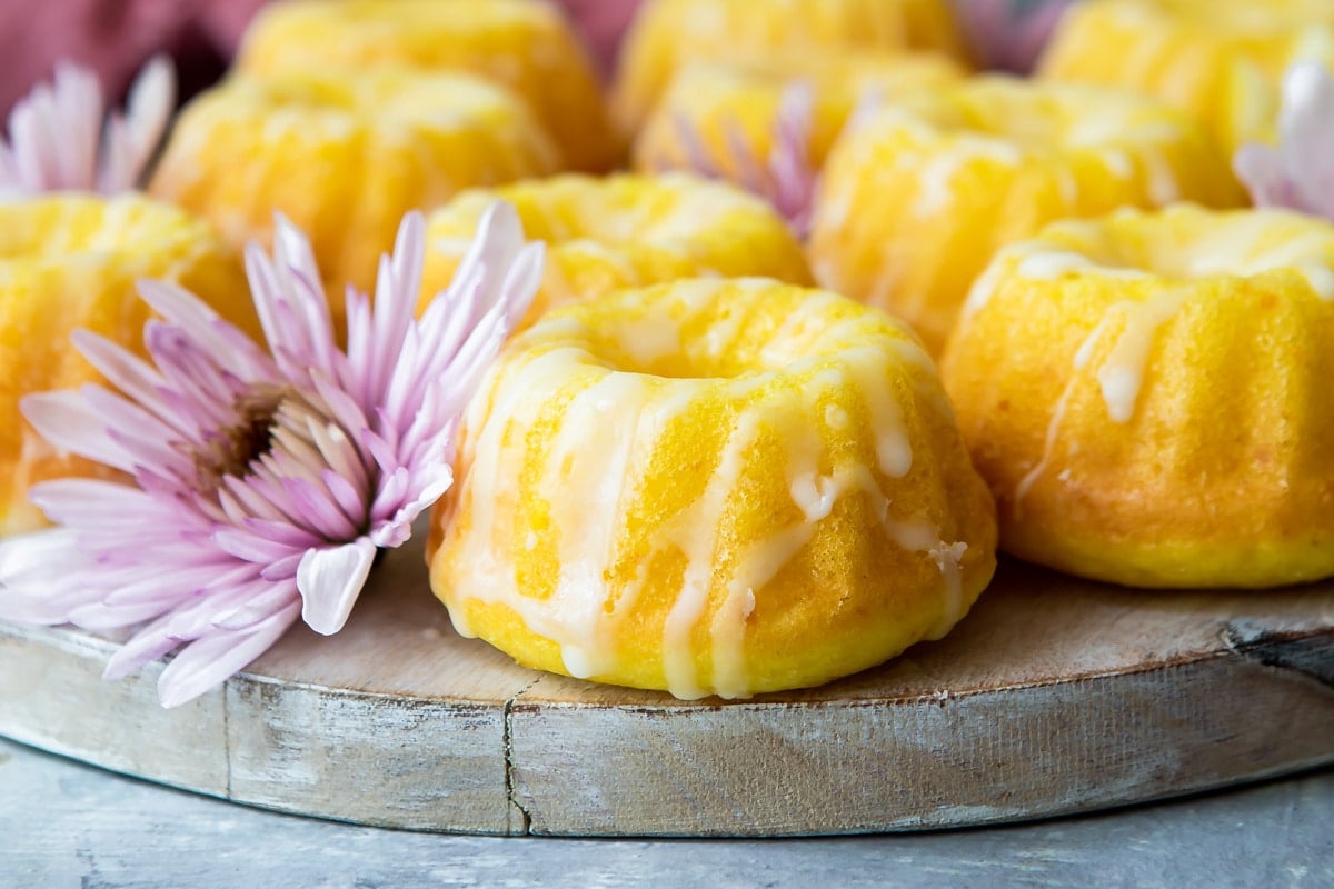 Mini lemon bundt cakes on a board.