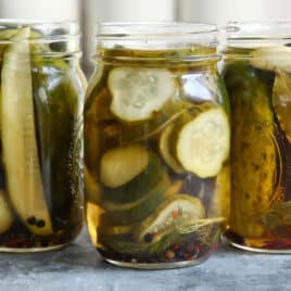 Three jars of pickles without lids.