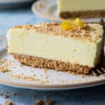A slice of no bake lemon cheesecake on a small plate.