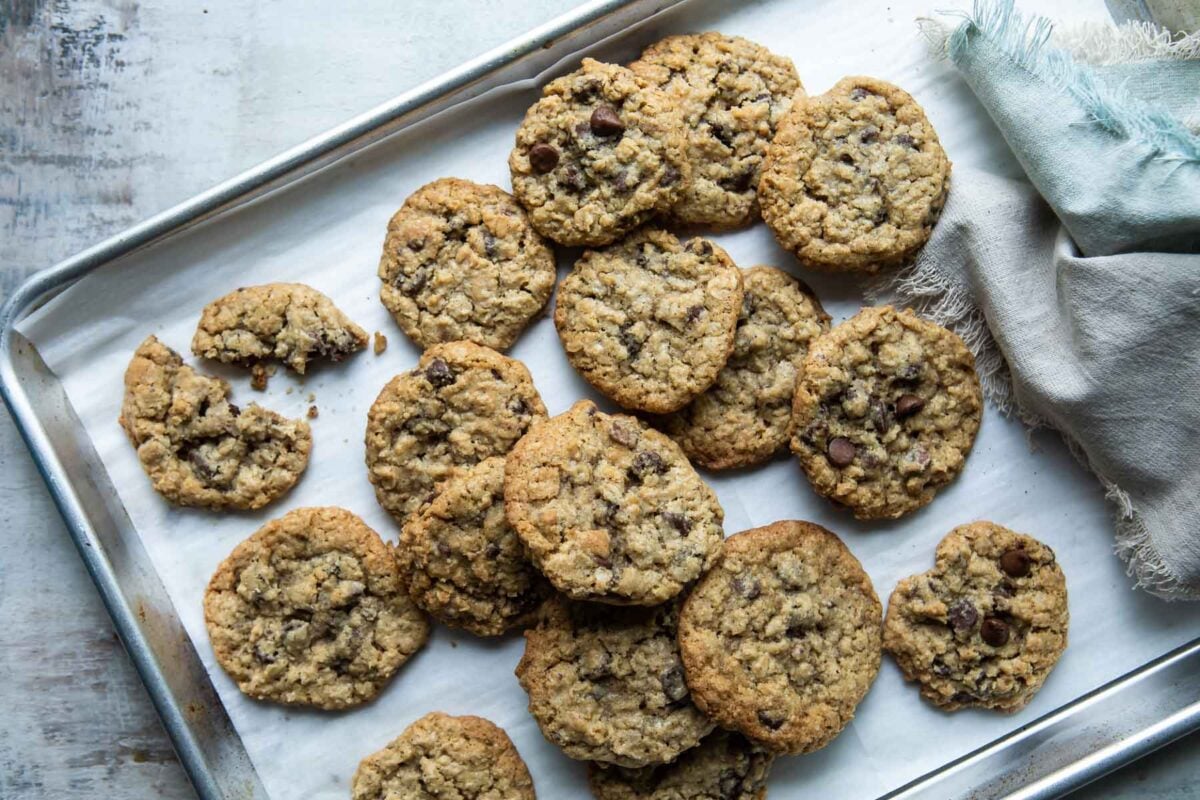 Oatmeal chocolate chip cookies on a baking sheet.