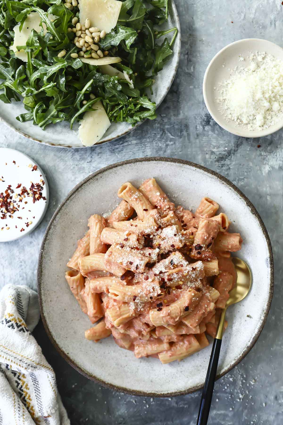 Penne alla vodka on a gray plate.