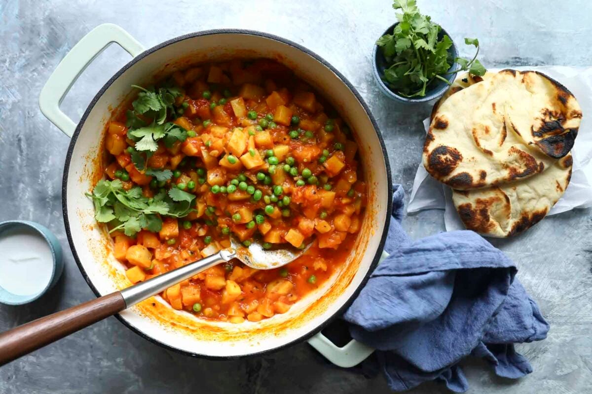 A Dutch oven full of potato curry.