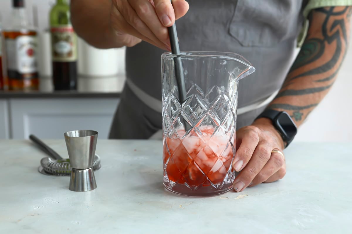 A boulevardier cocktail being mixed.