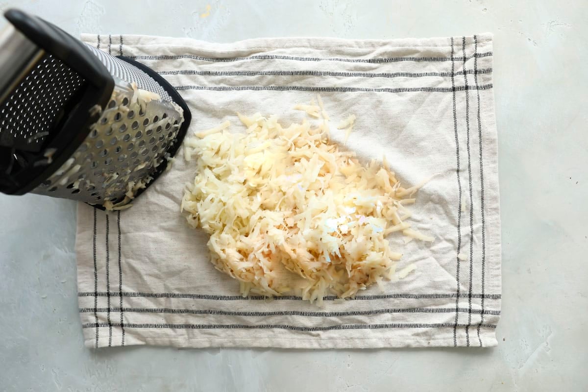 Shredded potatoes on a kitchen towel.